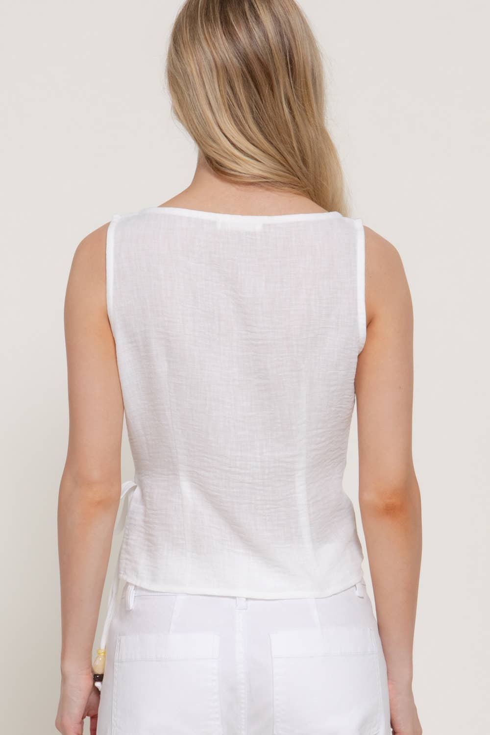 Sleeveless Boat Neck Top with Asymmetrical Hemline