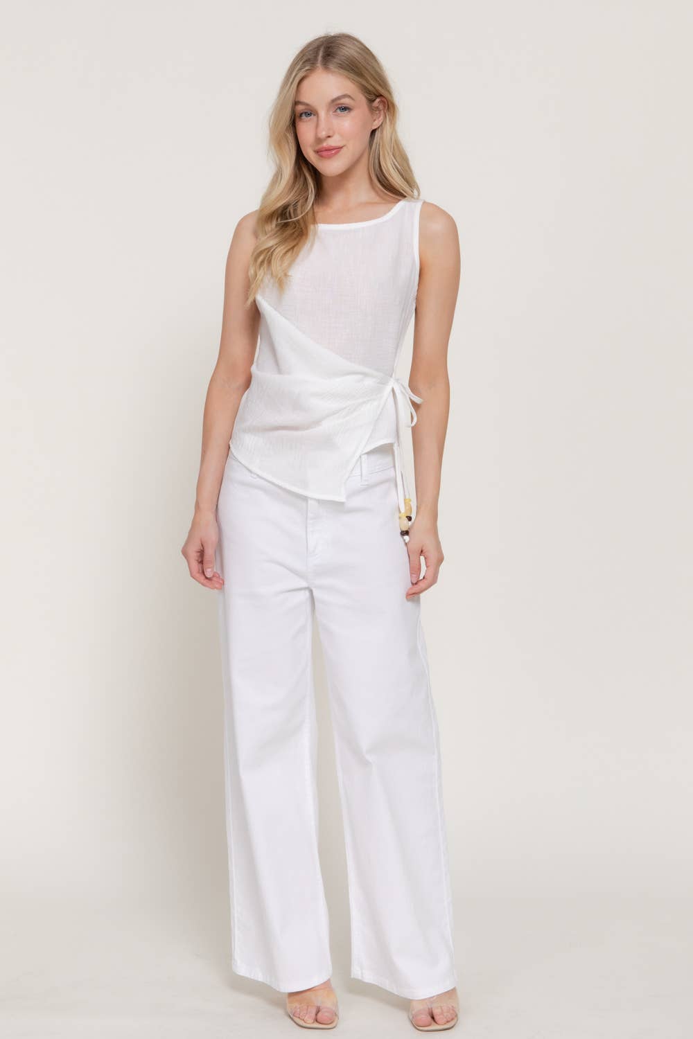 Sleeveless Boat Neck Top with Asymmetrical Hemline
