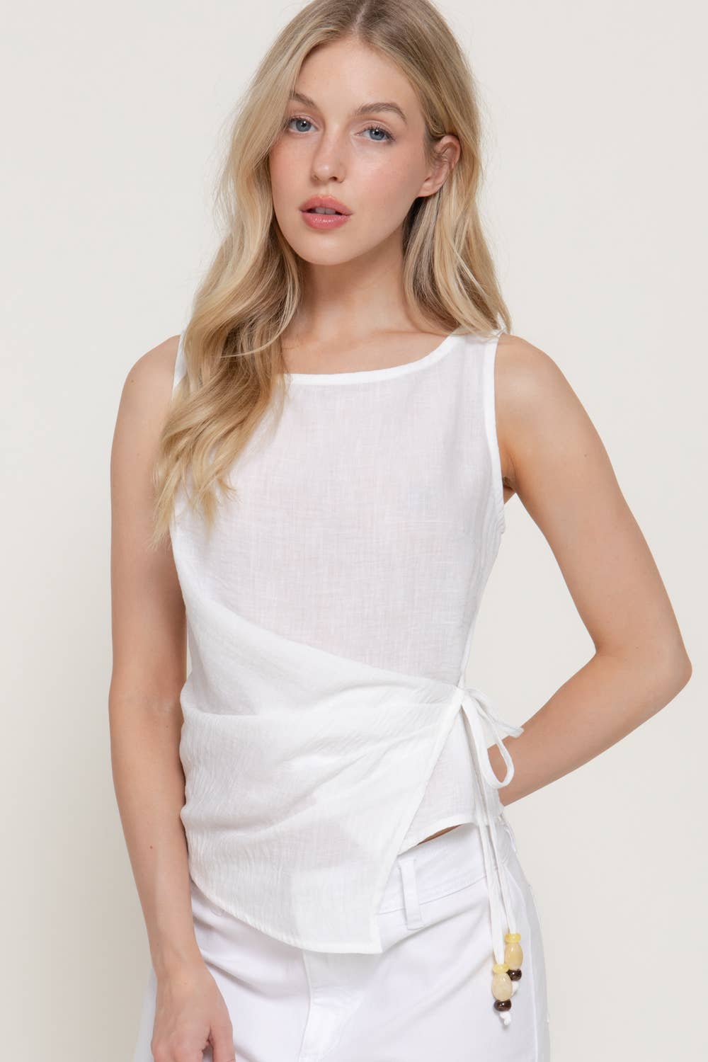 Sleeveless Boat Neck Top with Asymmetrical Hemline