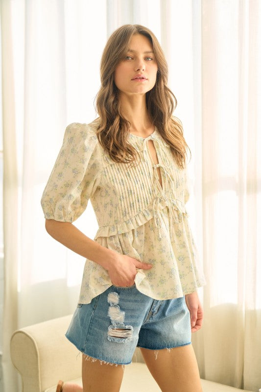 Floral pleated front tie ruffled top